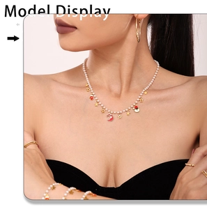 Model wearing Christmas jewelry set with pearl necklace and red enamel pendants