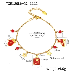 Detail of Christmas enamel charms on a 18K gold-plated stainless steel chain bracelet