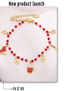 Detailed shot of stainless steel bracelet with festive red beads and holiday-themed charms
