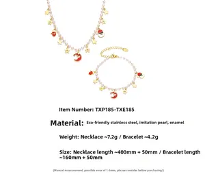 Macro view of Christmas jewelry set with Santa Claus and pearl charms in stainless steel