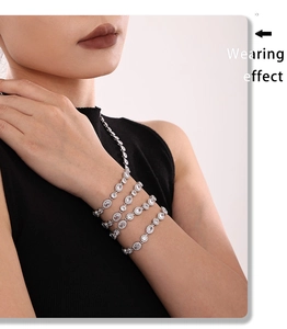 Wearing effect of silver-toned tennis bracelet with sparkling zircons on female wrist