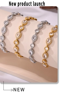 Detailed view of four luxury zircon bracelets in gold and silver plating on a display stand