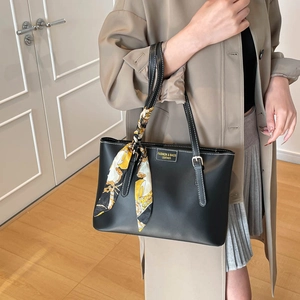 Black tote bag with white contrast stitching and floral silk scarf for women's office style
