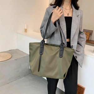 Army green large nylon tote bag for women with black leather handles for daily commute