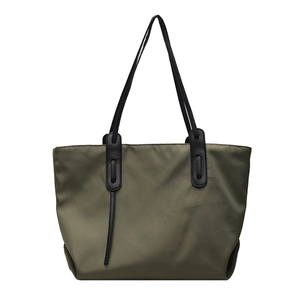 Minimalist army green nylon tote bag with black faux leather straps for daily commute