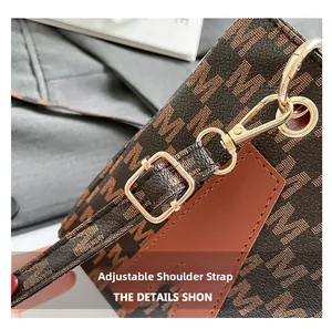 Detail of adjustable leather strap with gold buckle and monogram tote bag pattern