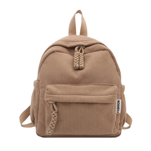 Minimalist corduroy mini backpack in khaki with textured vertical stripes and zip pocket