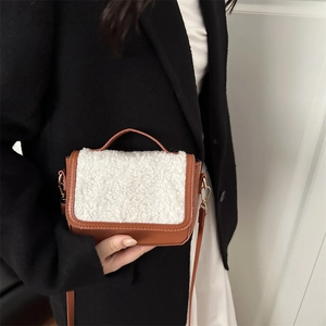 Vintage caramel faux leather crossbody bag with white shearling trim and gold hardware