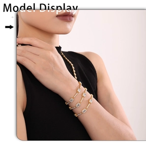 Detail of gold layered bracelets featuring emerald cut cubic zirconia and pavé halo setting
