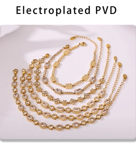 Detail of PVD plated gold bracelets set with various zircon shapes and lobster clasp