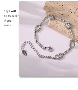 Macro shot of silver stainless steel bracelet with rectangular cubic zirconia and lobster clasp