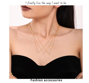 Three-layer gold necklace set featuring zircon letters H X K and heart pendants on model
