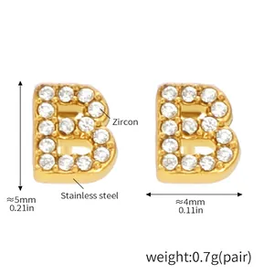 Detail view of gold-plated stainless steel letter B stud earrings with zircon inlay