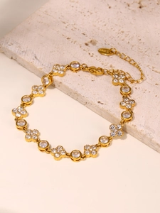 Detail of 18k gold plated flower bracelet with cubic zirconia and lobster clasp
