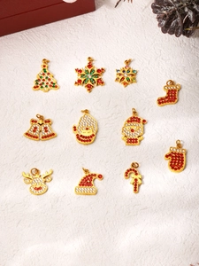 Detailed set of 11 Christmas themed pendants with zircon stones and festive gold coating