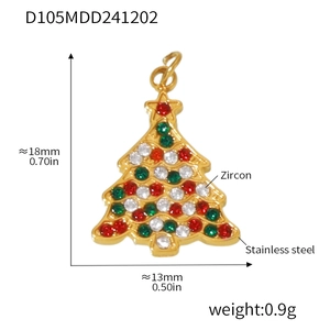 Macro detail of Christmas tree pendant in gold stainless steel with zircon stones