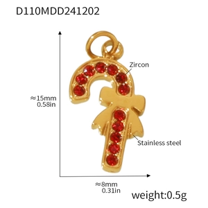 Detail of candy cane pendant in gold stainless steel with red zircon and bow