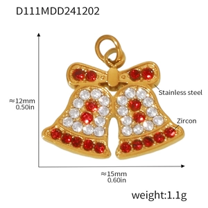 Macro shot of 12mm x 15mm stainless steel Christmas bow pendant with red and white zircons