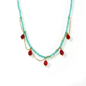 Handmade beaded necklace with turquoise stones and red teardrop pendants in gold layers