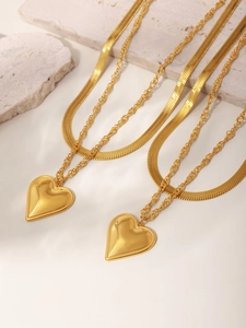 Detailed view of layered 18K gold-plated stainless steel chain with a heart pendant
