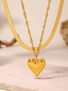Detail of 18K gold-plated double-layer necklace with heart pendant and herringbone chain