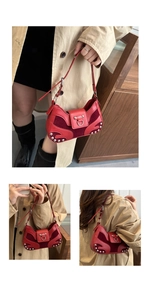Detail of red vintage leather bag with silver studs and suede patchwork design