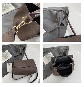 Detail view of brown suede tote bag featuring gold hardware and internal compartments