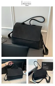 Detail view of premium black frosted leather tote bag with wide shoulder strap