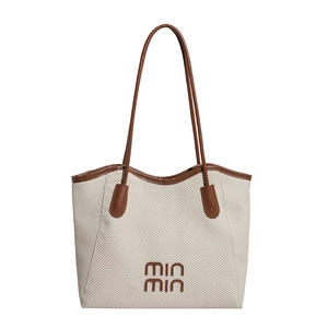 Chic woven tote bag in cream and brown with slim shoulder straps for women