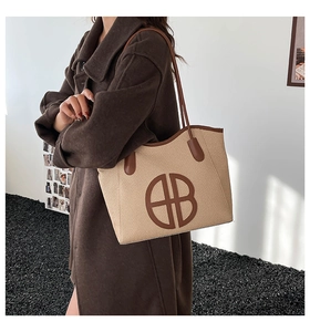 Retro contrast large capacity tote bag with woven texture and leather handles shown by model