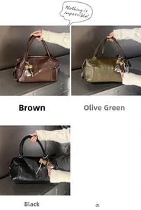 Detail of vintage PU leather Boston bags in brown, green, and black with bow charms