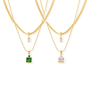 Double-layered gold chain necklace featuring green and clear square zircon pendants