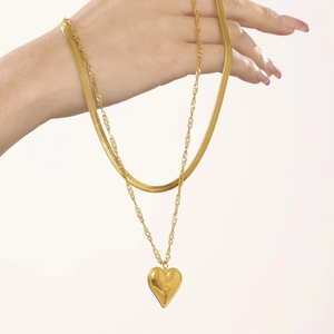 Double layer gold necklace with flat snake chain, twisted chain and 18K heart pendant
