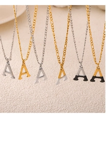 Detail of six alphabet A pendants in gold and silver finish with enamel drips
