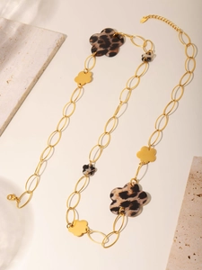 Detailed view of the lobster clasp and adjustable extension chain on this long gold necklace
