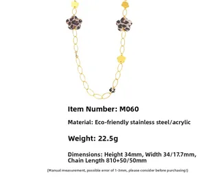 Detail showing gold stainless steel chain with leopard print acrylic flower charms