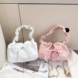 Chic pleated handbag with large sheer bow and chain strap in white and pink colors