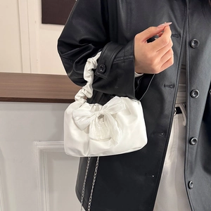 White mini handbag with bow detail, pleated cloud handle and silver chain strap