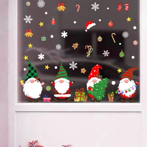 Christmas gnome window clings set with snowflakes and bells on glass pane