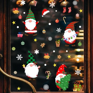 Christmas window stickers featuring gnomes, snowflakes, and bells for holiday glass decoration