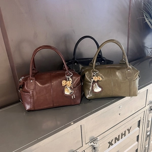 Retro Boston handbags in black, brown, and green with heart charms and leopard accents
