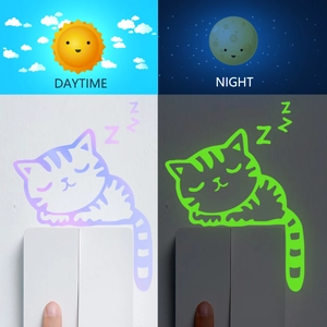 Glow-in-the-dark sleeping cat light switch sticker with daytime and night effect