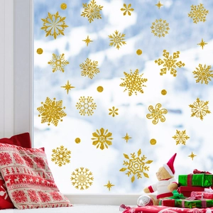 Close-up of golden snowflake static window stickers with sparkling glitter finish for Christmas