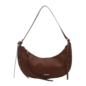 Minimalist brown hobo shoulder bag with soft textured finish and decorative side straps