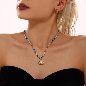 Ethnic beaded necklace with evil eye pendant and gold crystal hoop earrings set