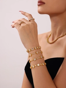 Close-up of 18K gold plated stainless steel jewelry set with sparkling zircon stones
