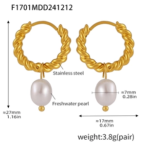 Macro detail of 18K gold plated twist hoop earrings with freshwater pearls and 27mm height