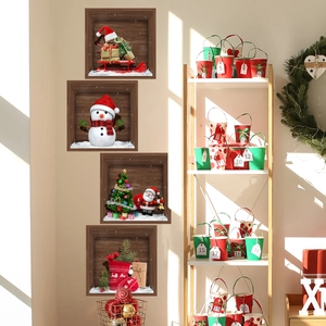 Detail view of 3D Christmas wall stickers featuring snowmen and Santa in a home setting