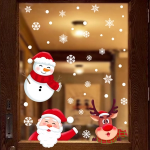 Detail of Christmas window stickers featuring Santa, snowman, and reindeer on glass