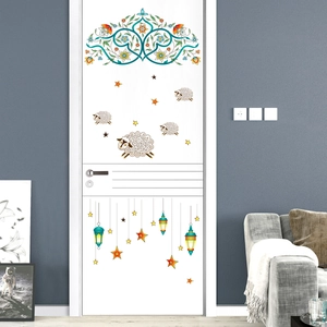 Detail of floral vine star and lantern wall stickers on a dark modern living room wall
